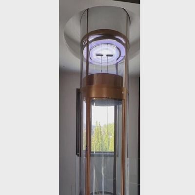 Circular glass elevator with a panoramic cabin